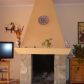 Click for full size image of Part of sitting-room featuring a chimney
