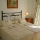 Click for full size image of Holiday in Narja - Twin bedroom with door to balcony