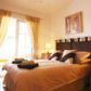 Click for full size image of Apartments in Nerja - Double bedroom with door to terrace