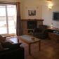 Click for full size image of Holiday Apartments Nerja - Lounge showing TV and access to Roof Terrace