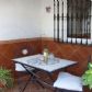Click for full size image of Villas in Nerja - Terrace with table and chairs
