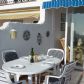 Click for full size image of Villas in Nerja - Terrace with table and chairs