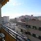 Click for full size image of Apartments in Nerja - Terrace with table, chairs and view of area
