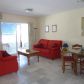 Click for full size image of Holiday in Nerja -Lounge dining room with doors to balcony