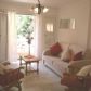 Click for full size image of Lounge / dining room with door to private terrace